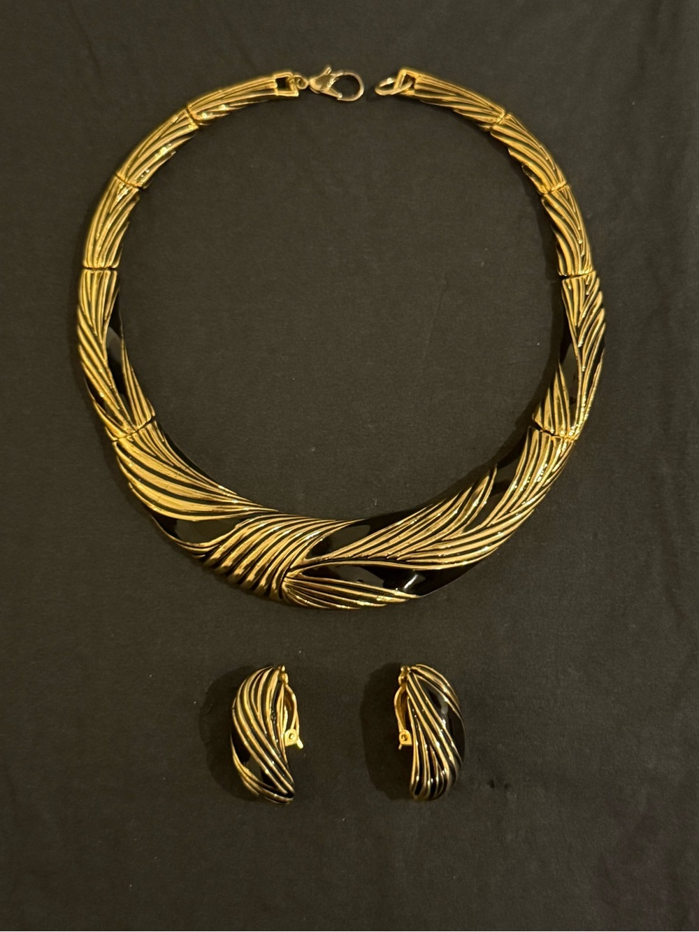Vintage black and gold-toned costume necklace with matching clip-on earrings